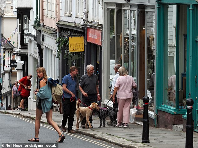 While many high streets across the country are declining, when MailOnline visited at 11am on a weekday Totnes town centre was already bustling with shoppers