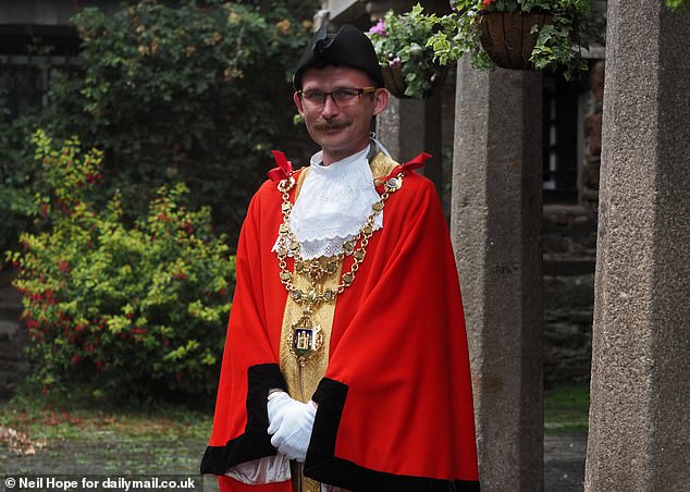 Pictured: Town Mayor Tim Bennett who proudly dons red robes, white gloves, and a gold chain before advising that he¿s the 592nd Mayor of Totnes