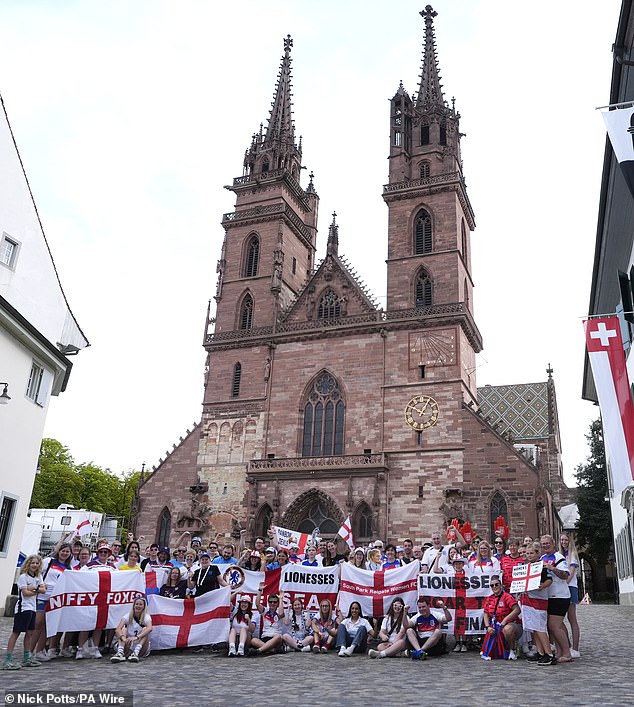 England fans pose for photographs in Munsterplatz ahead of the UEFA Women's Euro 2025 final at St. Jakob-Park in Basel, Switzerland