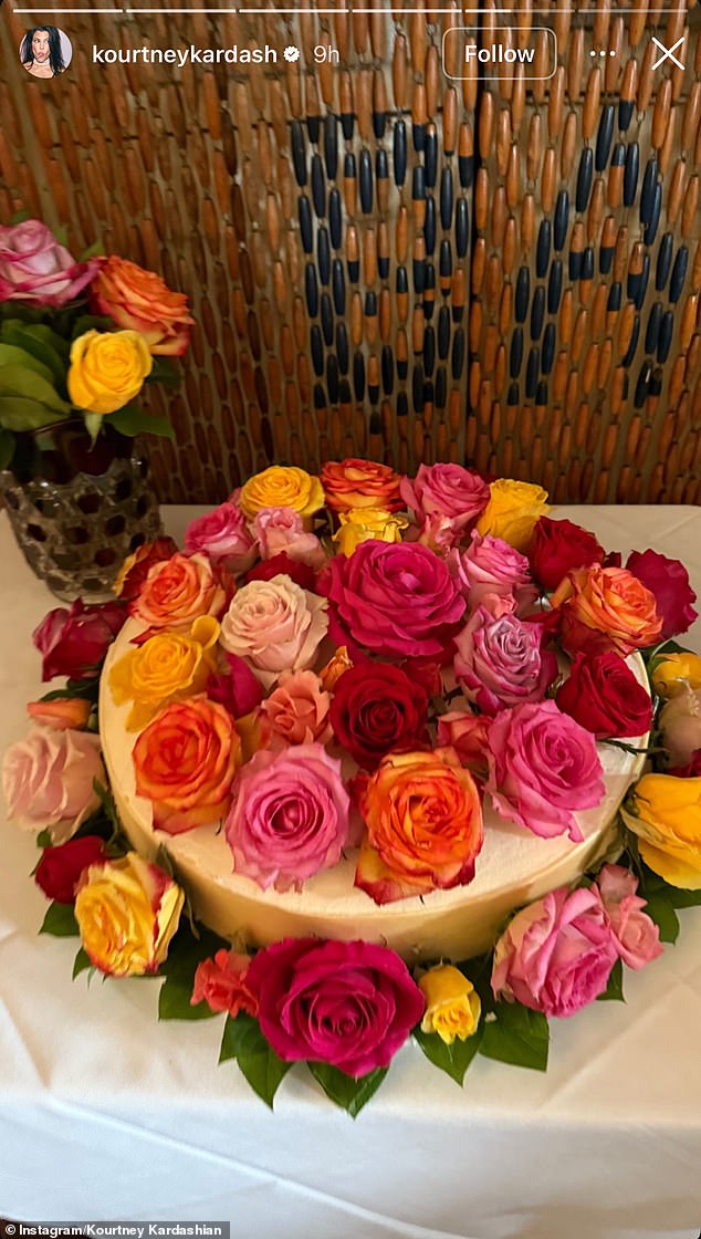 Kourtney Kardashian couldn't resist showing fans the wedding details, including the wedding cake covered in colourful roses