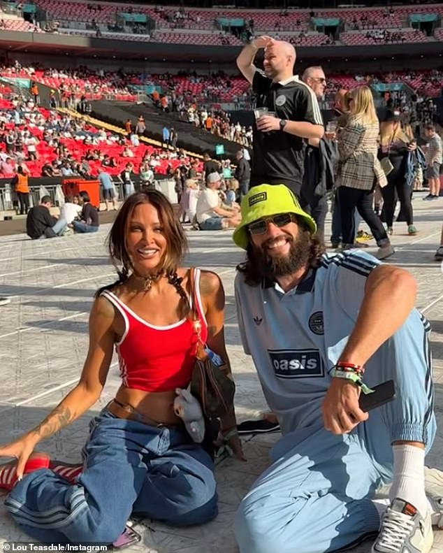 Lou joked about the pair not being in hospitality as they sat on the floor ahead of the concert due to having standing tickets at the stadium