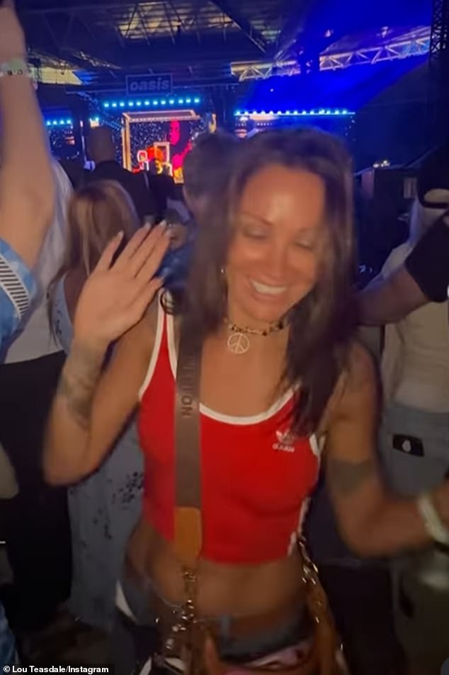 She showed off her toned abs in a red Adidas crop top which she teamed with blue jeans