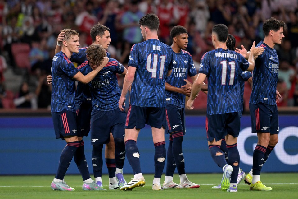 Arsenal players celebrating a goal.
