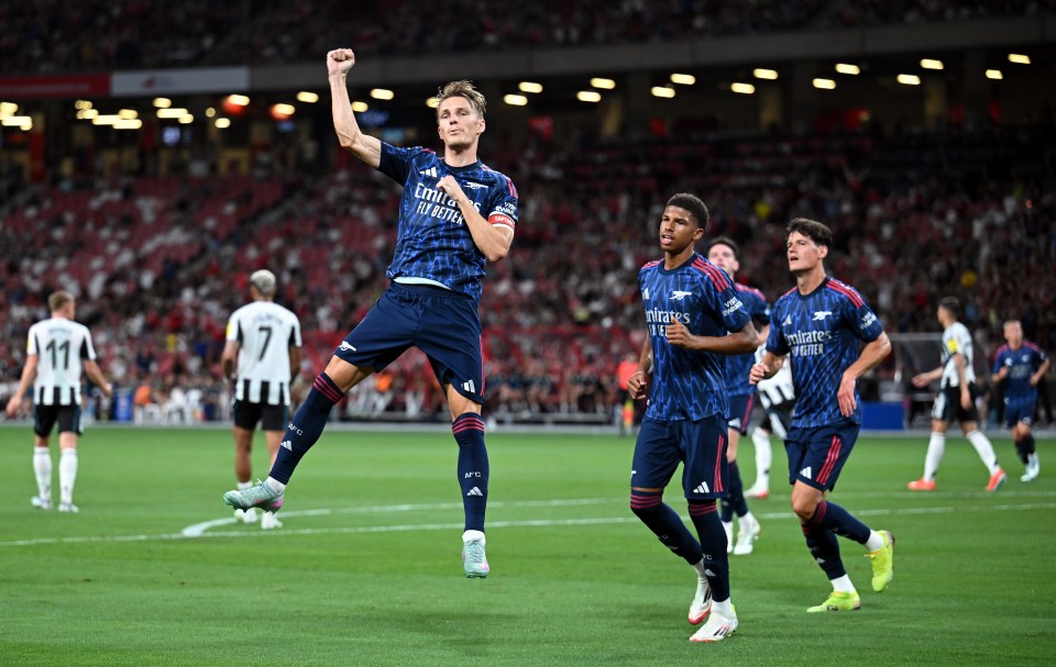 Martin Ødegaard of Arsenal celebrates scoring a goal.