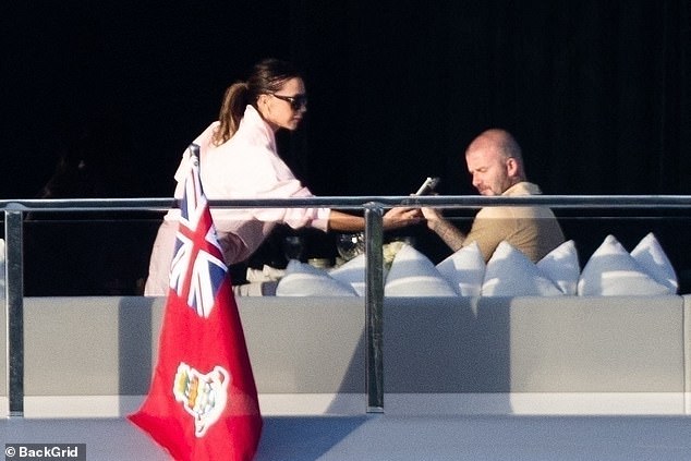 Soaking up the sunshine on their £16 million vessel, David and Victoria were seen making the most of the picturesque French weather off the coast of St Tropez