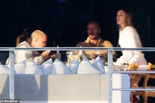 The family were seen relaxing on their luxurious yacht together, with eldest son Brooklyn absent from the holiday