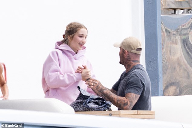 David put on a sweet display with his eldest daughter Harper, who toted her belongings in a Goyard Saint Louis bag