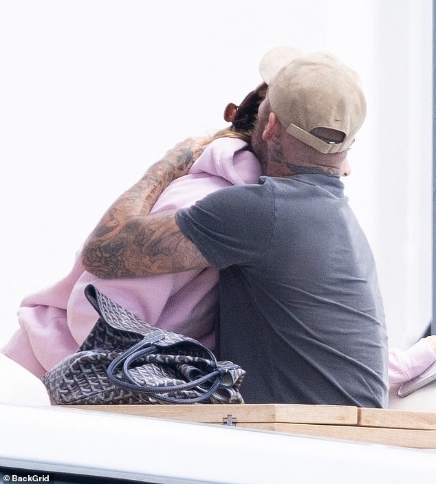 David shared a sweet embrace with his youngest daughter as they departed the luxury vessel to head to the shore together