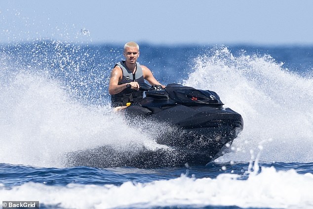 While his parents relaxed on their luxury yacht, Romeo enjoyed a ride on a jet ski across the ocean in the St Tropez sunshine