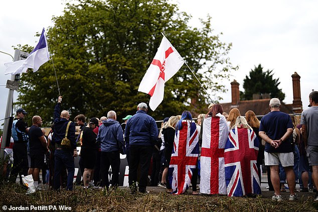 Many were seen draped in St George's and Union Jack flags as they took to the streets of Epping today
