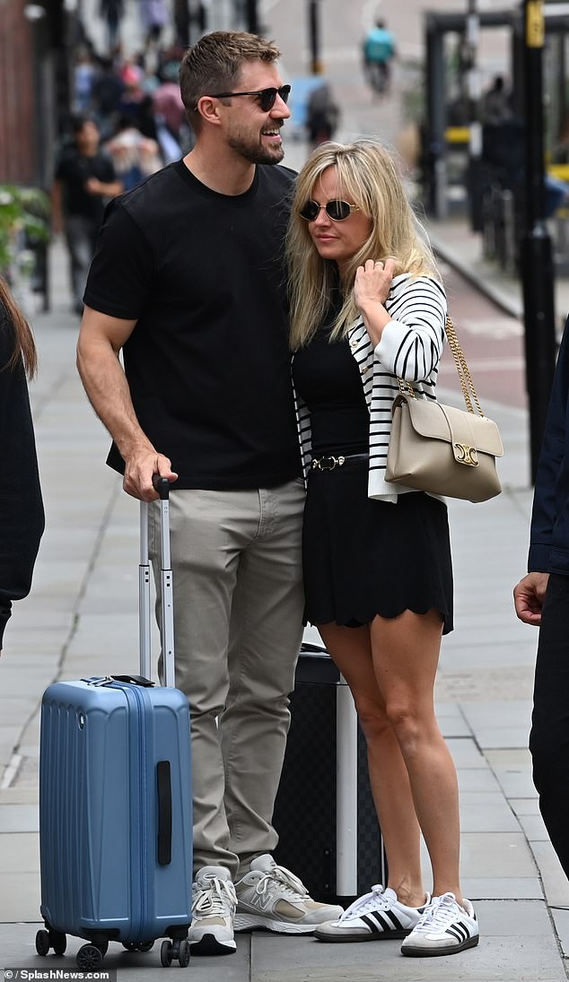 The pair were seen packing on the PDA outside their Manchester hotel on Sunday morning after debuting their romance publicly at Jack P. Shepherd's wedding the night before