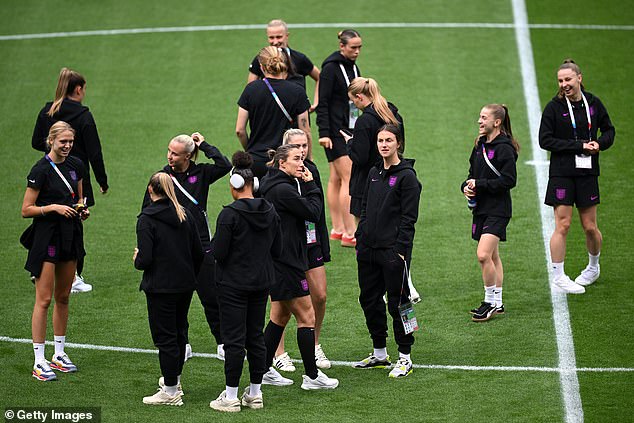 England's women appear in good spirits as they warm up in preparation for their all-important game against Spain