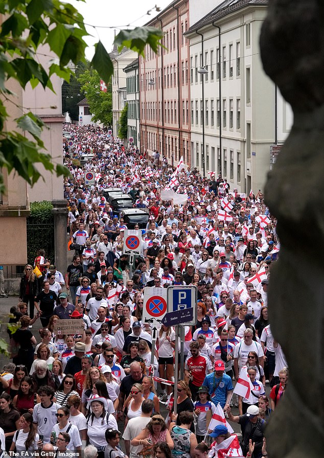 England fans participate in the fan walk to the stadium prior to the UEFA Women's EURO 2025 Final match between England and Spain