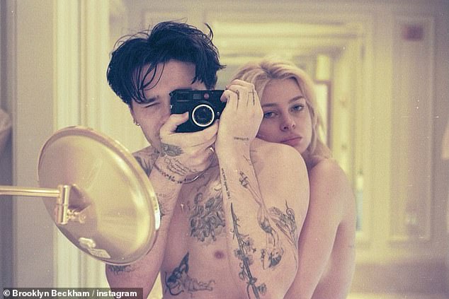 The couple stripped off for a steamy bathroom shoot, which saw the model ditch her clothing in favour of a simple towel wrapped around her head