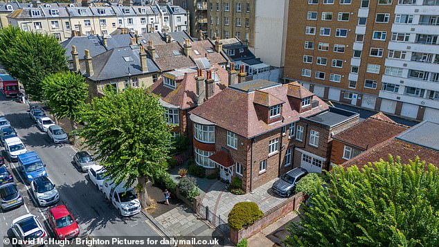 The £2.5million house sits on Third Avenue in the upmarket Hove and is just 100 yards from the pebble beach