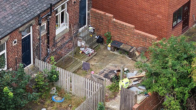 Forensic specialists were seen at the address and streets in the area have been cordoned off as they carried out their investigation