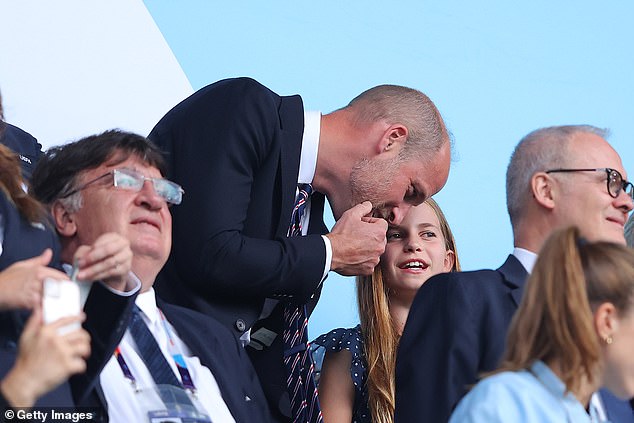 Charlotte looks to be on the edge of her seat at the gameplay, at one point whispering a spot of her own analysis to her smiling father (pictured)