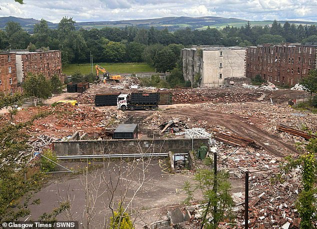 When MailOnline visited this week, we saw bulldozers hard at work demolishing the shells of apartments
