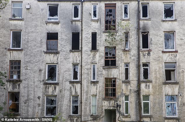 The estate is populated by hollowed out shop facades and burnt out offices