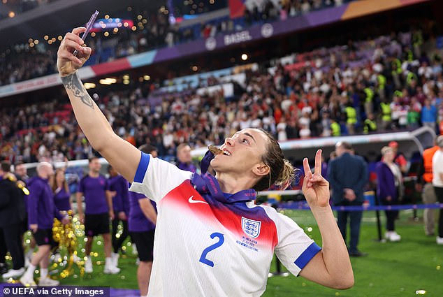Bronze, 33, looked delighted as she posed for a selfie with a winners medal around her neck