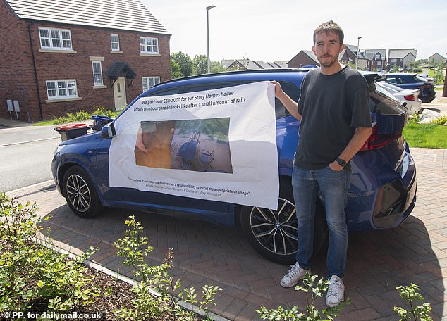 Dean Hodgson (pictured) fastened a banner showing his deluged patio to his blue BMW and parked it outside the estate office to give any potential customers a timely warning