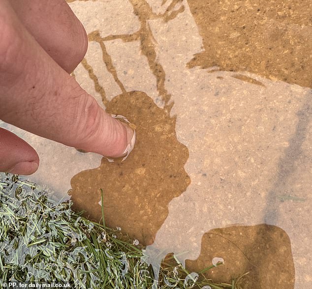 Homeowners living on an exclusive estate have gone to war with a housebuilding giant claiming poor drainage has left them with sunken gardens after every downpour