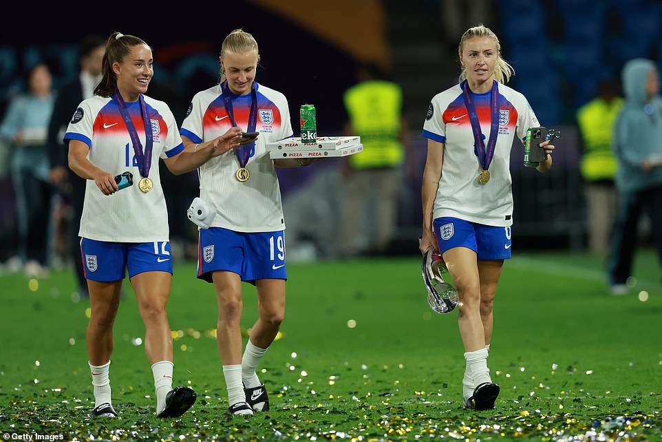 Beever-Jones and Leah Williamson (right) refuelled with pizza and beer after Sunday's big win