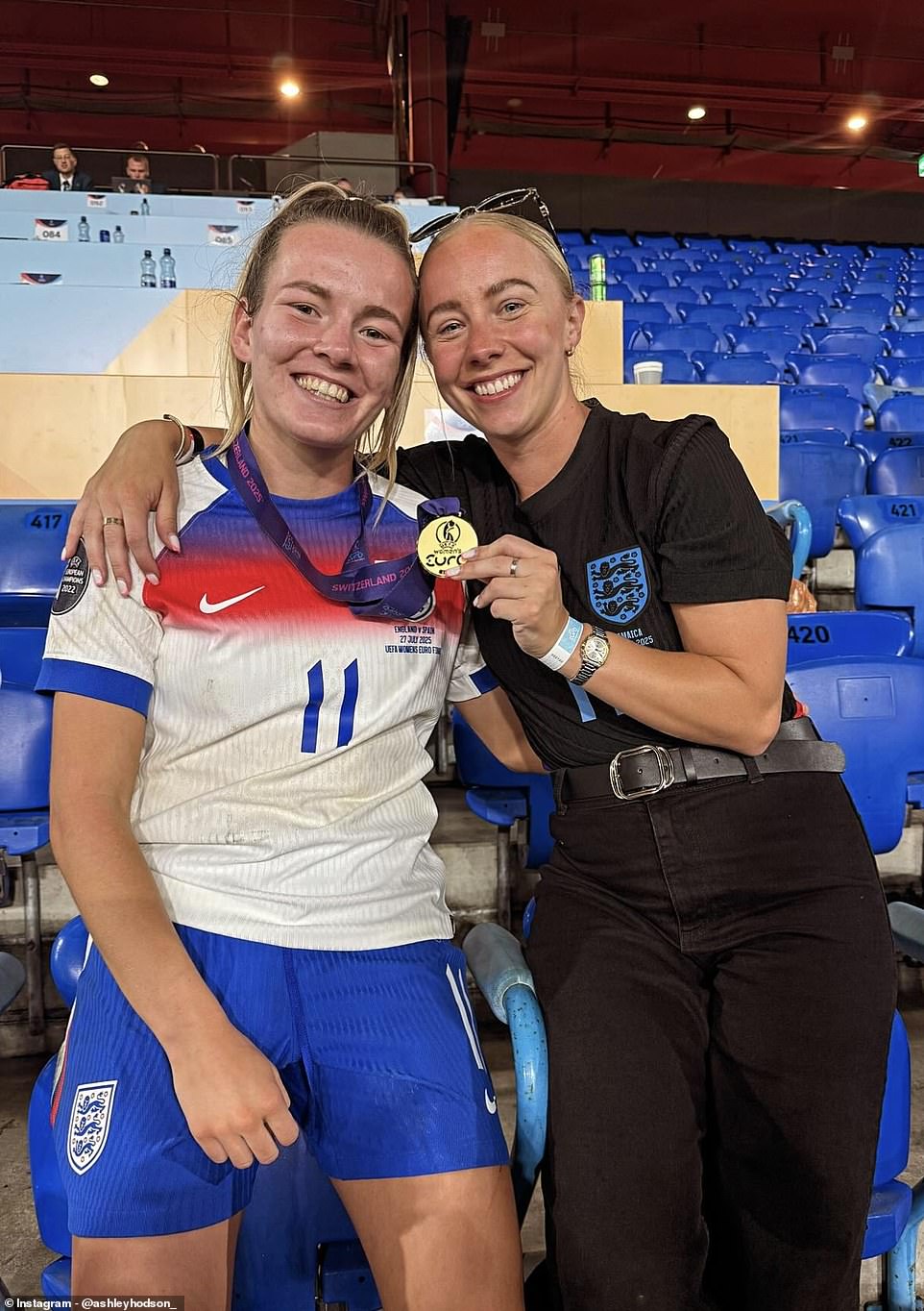 No 11 Lauren Hemp grinned widely as she posed next to girlfriend Ashley Hodson in the stands