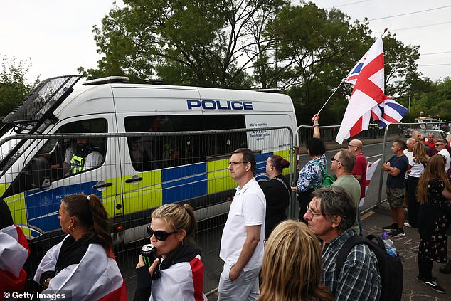 Mr Philp's intervention comes amid heated protests (pictured) outside The Bell Hotel in Epping, Essex, which houses migrants