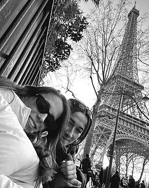 Batlle and Bronze take a selfie with the Eiffel Tower in the background