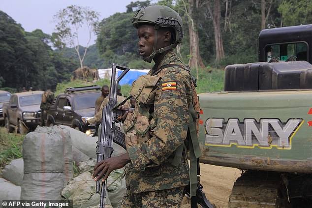 In a bid to stem attacks, the DR Congo let Ugandan soldiers into the country in 2021, but it did little to reduce the killing (pictured: a Ugandan troop in Beni, DR Congo)