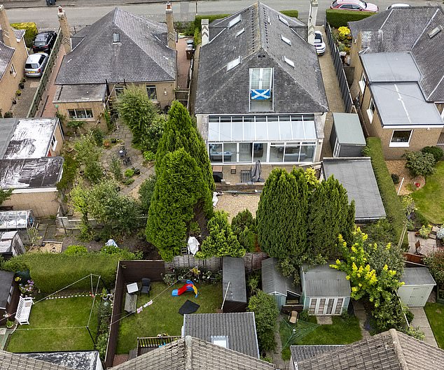 The row with the owners of the cypress trees (above), David Hunter and Niena Hunter Mistry, has rumbled on for five years and seen the gardens inspected several times by various officials