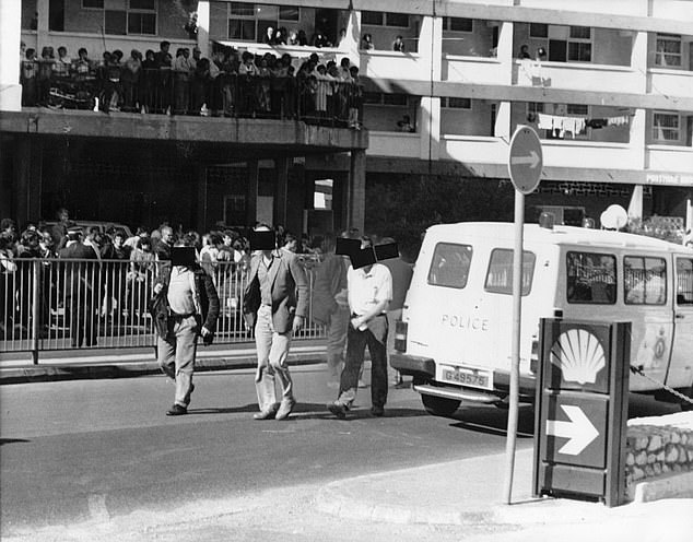 Security men, believed to be SAS, leave the scene of the shooting of IRA terrorists suspected of planning a car bomb attack on British military personnel in Gibraltar in 1988