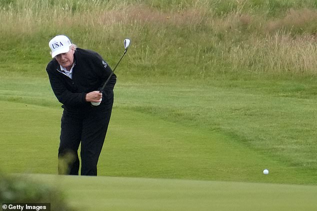 Mr Trump is pictured playing a round of golf at Trump Turnberry on Sunday during his visit to Scotland