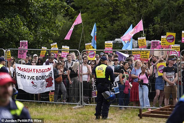 They were there, of course, to stage a counter-protest (pictured) against the latest demonstration by local people over the hotel being used to house migrants