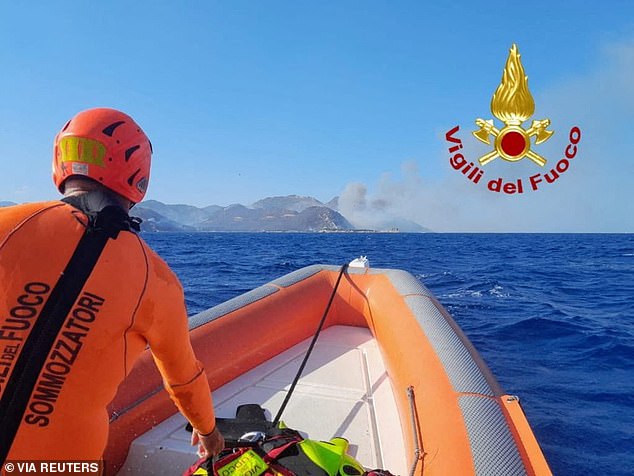 Beachgoers in Sardinia were forced to escape the fires on a boat as other escape routes were blocked by the blaze