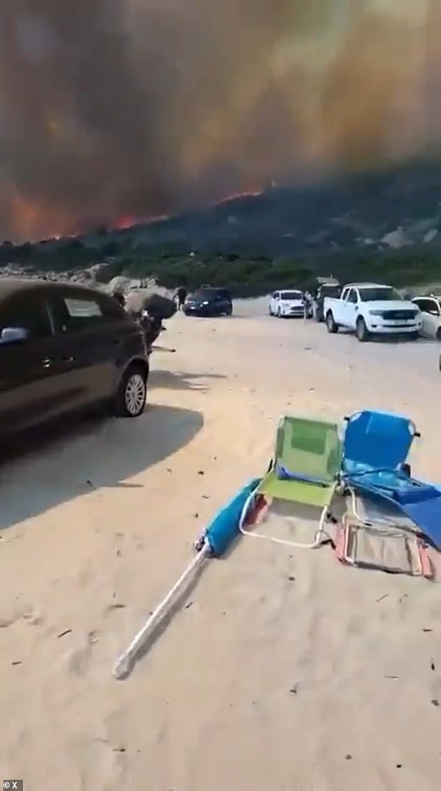 Black cloud could be seen in Sardinia as authorities rushed to get beachgoers to safety