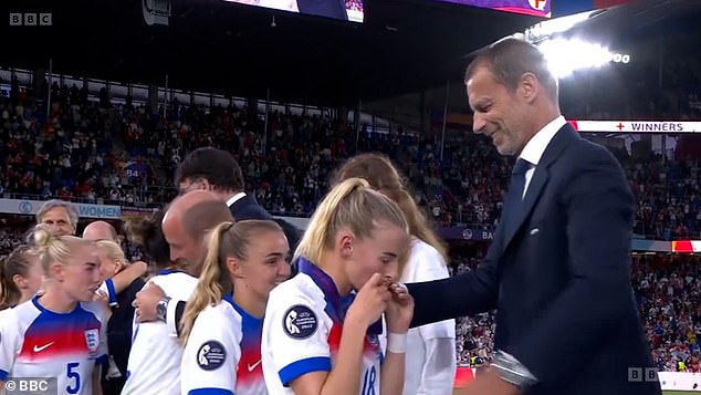 The Arsenal winger, who also scored the winner in England's 2022 Euros final win over Germany , kissed her medal before turning to the camera as she walked away and said: 'F***ing come on!'