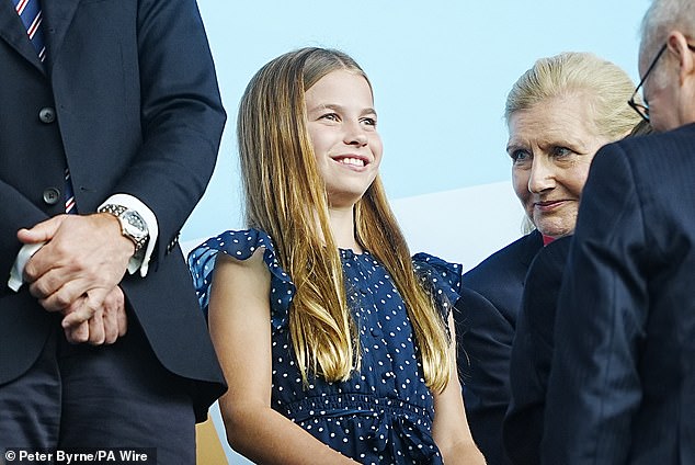 Princess Charlotte beamed, with FA chair Ms Hewitt smiling at the young royal's enthusiasm (pictured)