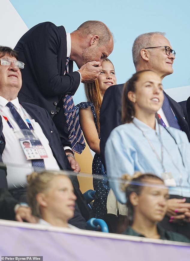 Other adorable pictures of William and Charlotte at the match show their clear close father-daughter relationship (pictured)