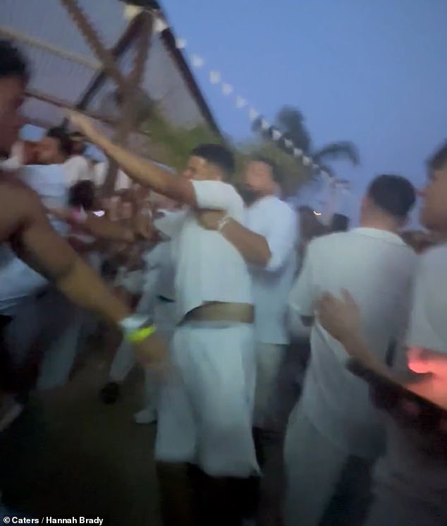 The violent thugs were seen hurling each other around and throwing fists despite efforts from to dispel the group by throwing ice water on them