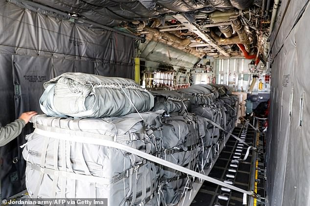 Humanitarian aid packages are loaded onto a C-130 Hercules military transport plane as part of missions to drop supplies into the beleaguered Gaza Stirp, on July 27, 2025