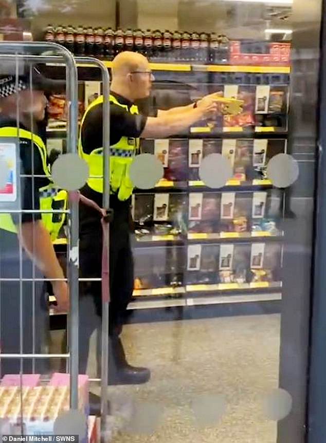 Police then arrived and trained a stun gun on him as he threw up his hands - before spraying him with CS incapacitant
