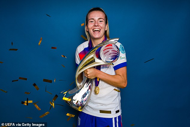 Hemp is seen posing for a portrait with the trophy after England defeat Spain 3-1