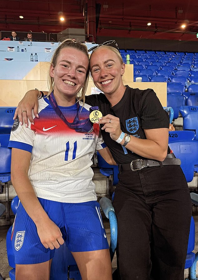 Lauren Hemp grinned widely as she posed next to girlfriend Ashley Hodson in the stands after victory over Spain in the Euro 2025 final