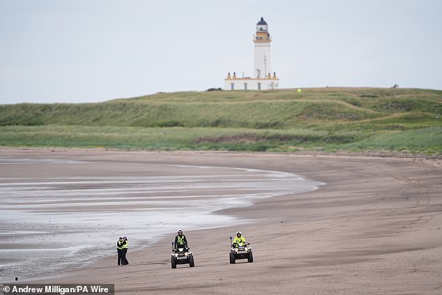 Police officers patrol during the visit by US President Donald Trump to his Trump Turnberry golf course in South Ayrshire