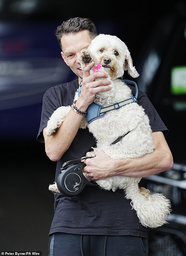 England's lucky mascot Reggie the Cavapoo leaves the team hotel on Monday after the Lionesses' historic triumph