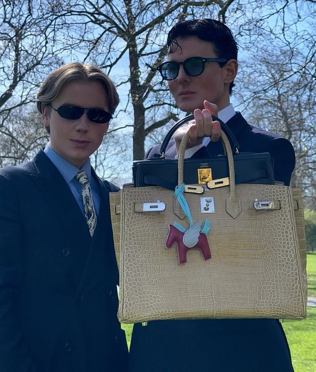 Liam Innes and James Hennessy pictured with a luxury Hermes Birkin bag, which has another high-end product inside it