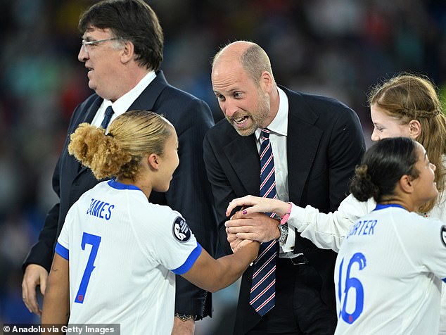 Prince William, Prince of Wales, shakes hands with Lauren James of England after the team's victory in the UEFA Women's EURO 2025 final match