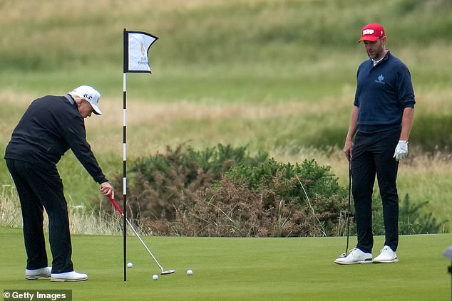 President Donald Trump and his son Eric play a round of golf at Trump Turnberry